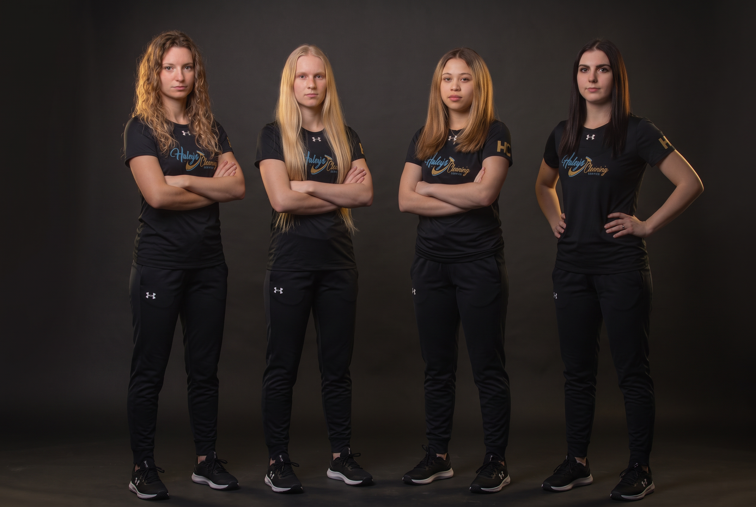 Haley's Cleaning Service crew in branded black uniforms outside a luxury Florida home
